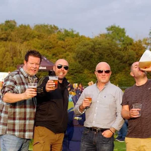 A group of guys enjoying a beer at one of our events A group of guys enjoying a beer at one of our events
