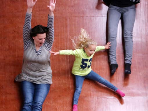 A family falling in our death slide having all weather fun