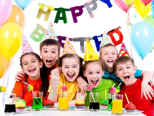 Everyone smiling at a kids birthday party venue