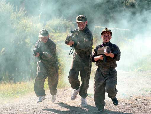 Older kids playing Battlefield Live as part of a team building activities