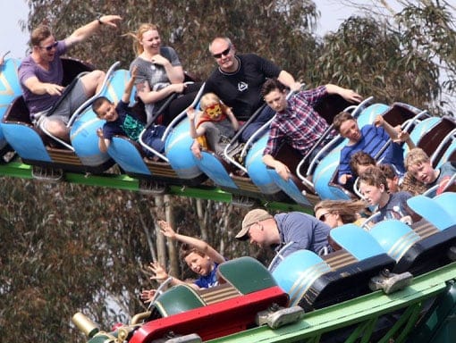 People zooming along on the Rampage Roller Coaster