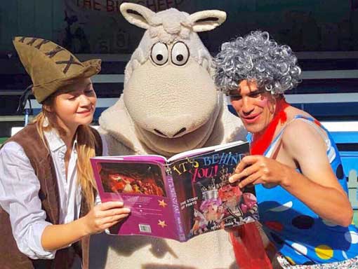 Wooly The Sheep reading a book with a clown