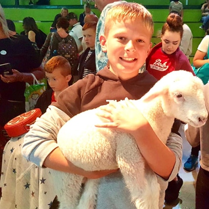 Boy holding Lamb